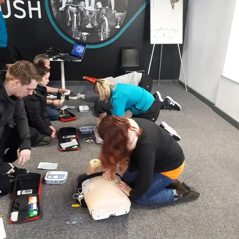 First aid course delegates practising skills with Assured First Aid