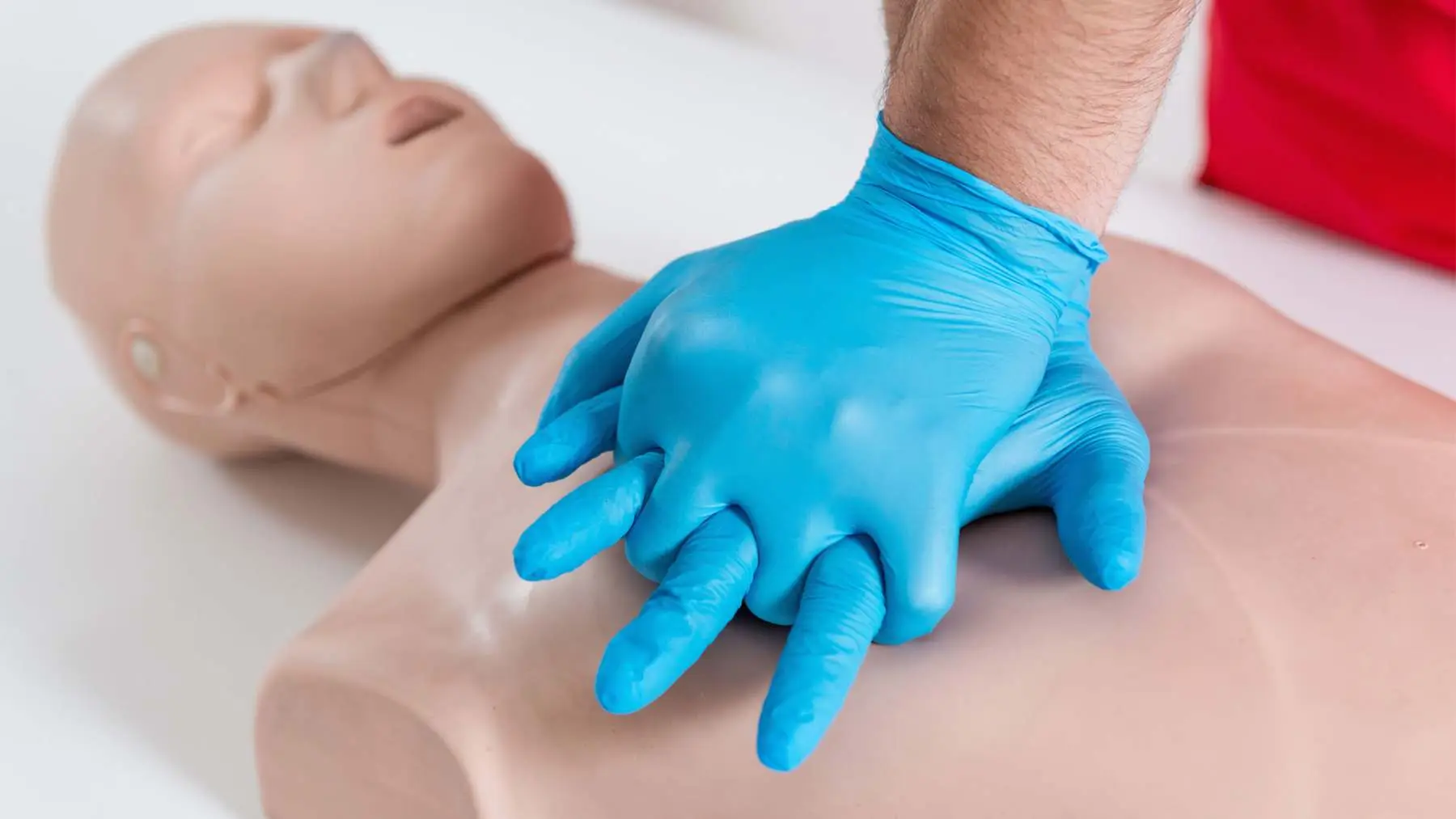 Paediatric CPR practice on an infant manikin Assured First Aid Salisbury