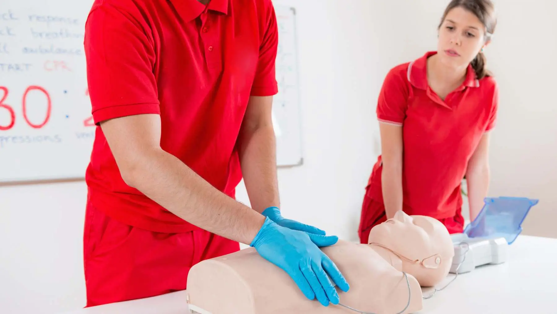 Delegate practising CPR on a manikin during first aid training Assured First Aid Salisbury